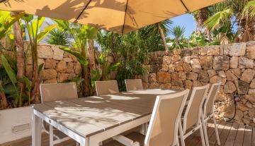 Resa Estates Ibiza sale ted koop Cala Tarida patio townhouse dining exterior.JPG